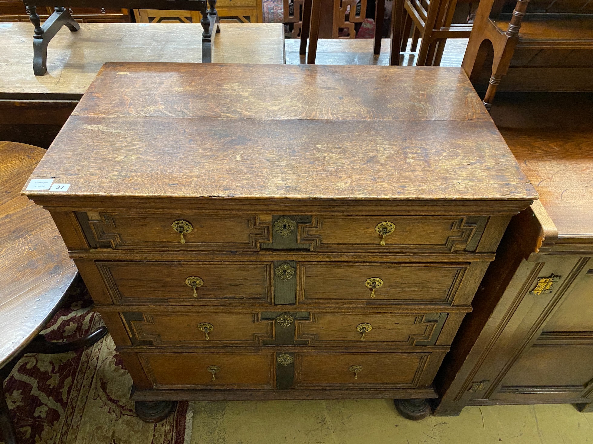 A 17th century style oak geometric four drawer chest, width 97cm, depth 54cm, height 99cm